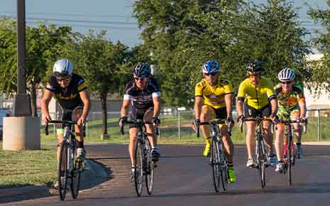 five men peloton cycling