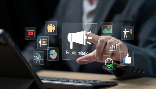 image with icons hovering over a podium with a man's hand pressing a "public relations" speaker icon